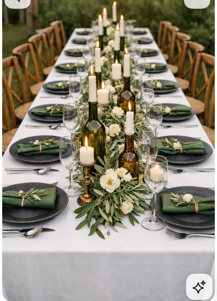 Olive branch runner with seasonal fruit on a fall dining table