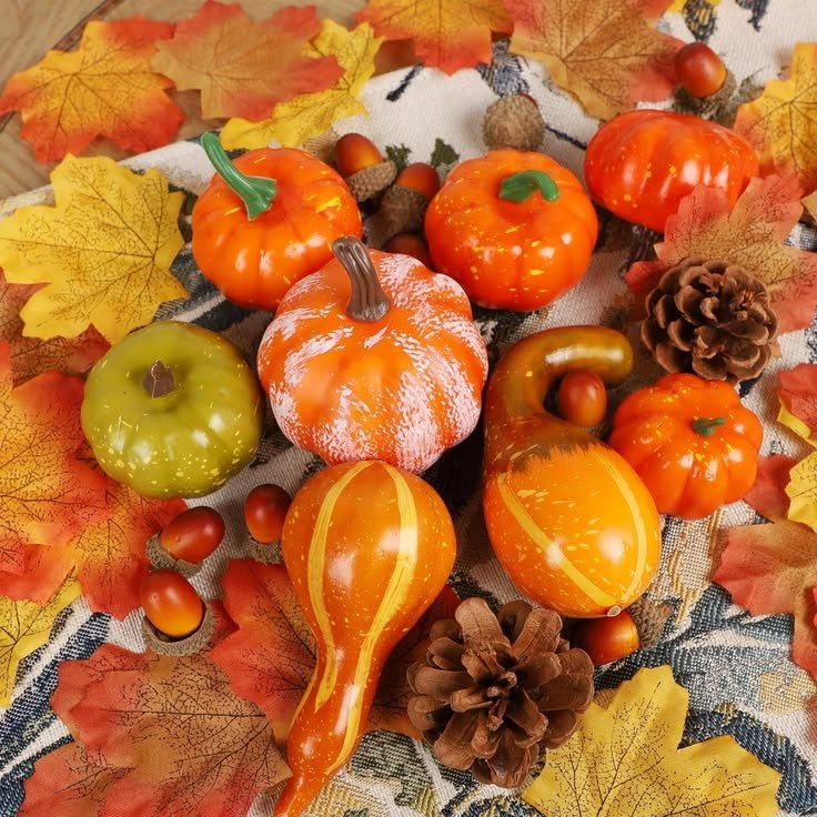 Mini gourds arranged on a linen runner for fall table decor
