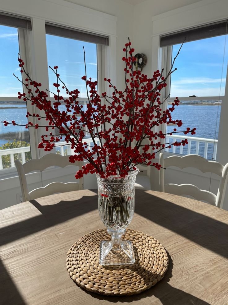 Autumn berry branches in a ceramic vase as a fall centerpiece