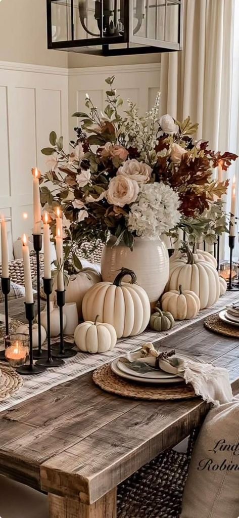 Neutral fall centerpiece with cream pumpkins and dried flowers