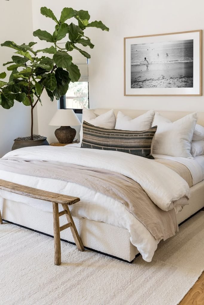 Cozy bedroom with a large textured area rug underneath the bed