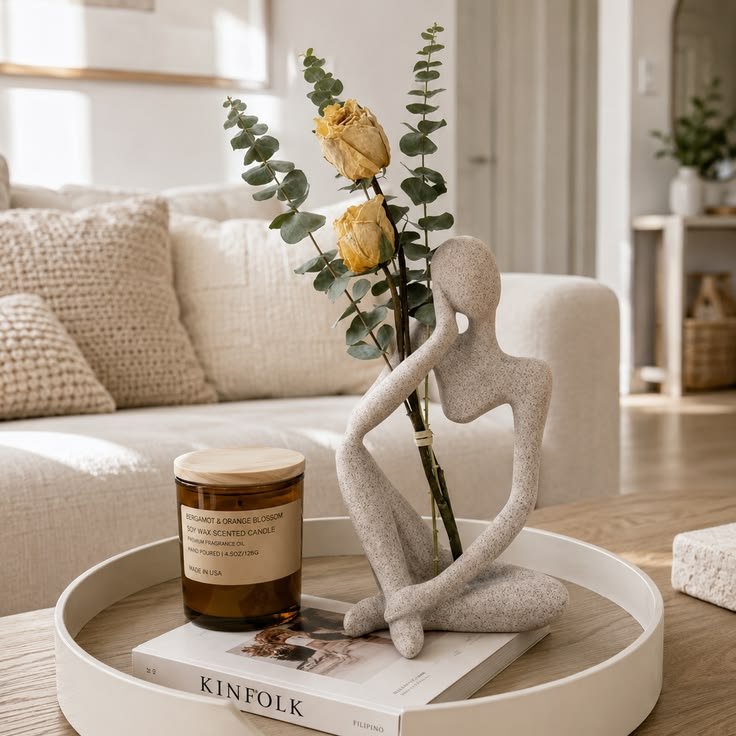 Sculptural ceramic object displayed on an entryway console table