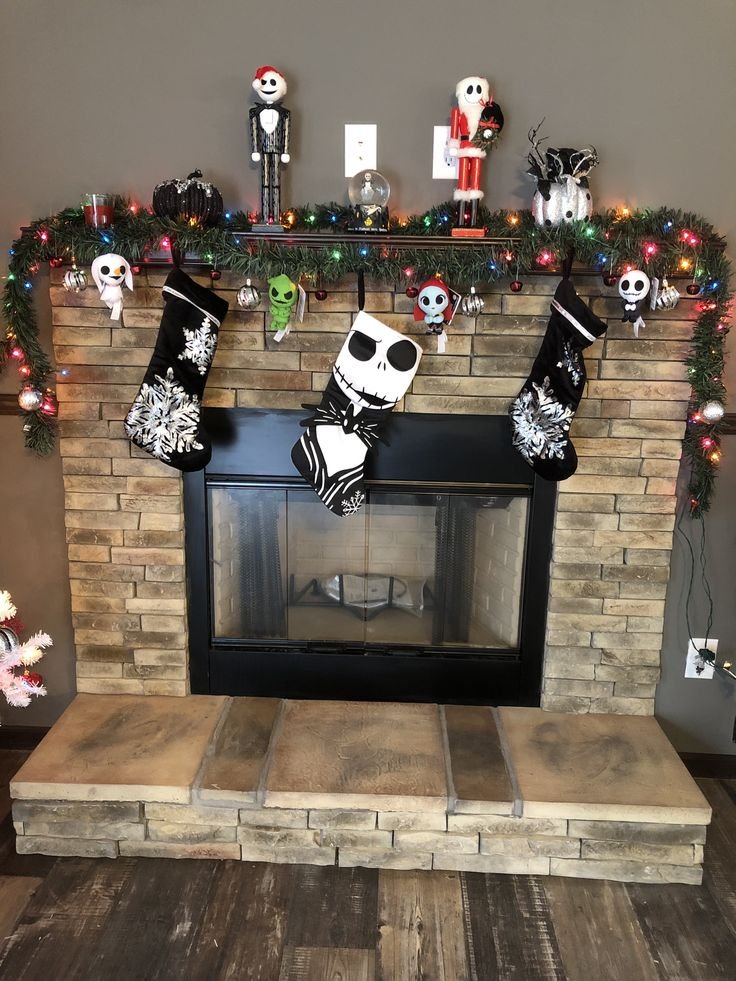 Nightmare Before Christmas inspired fireplace with black garland and stockings