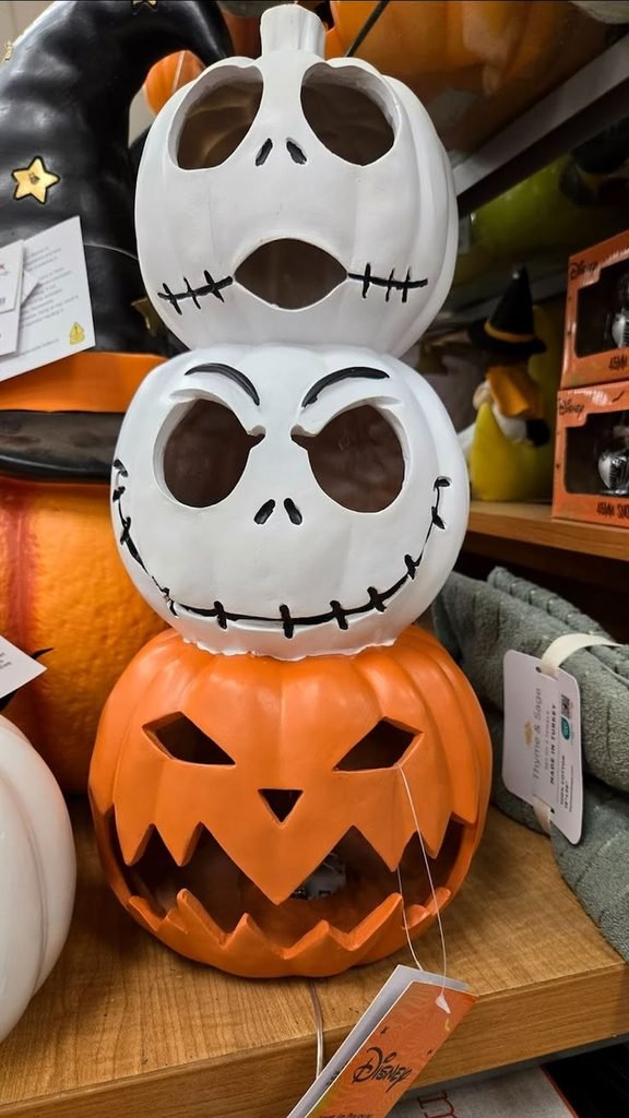 Jack Skellington inspired white pumpkin display on a console table