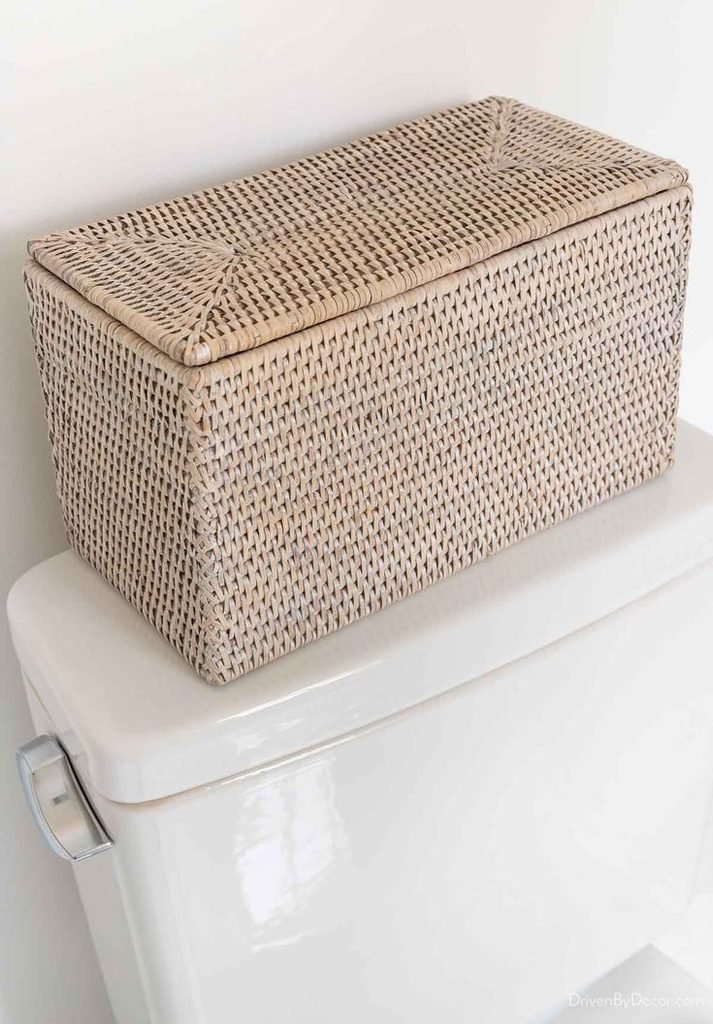Small decorative wooden box styled on a bathroom toilet tank