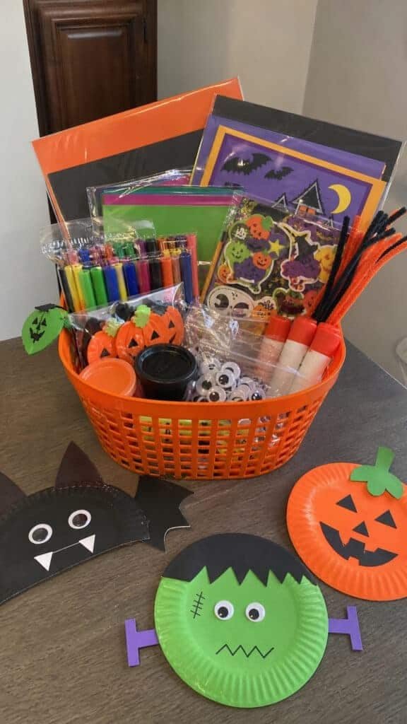 Halloween craft basket with pumpkin craft supplies markers and ribbon