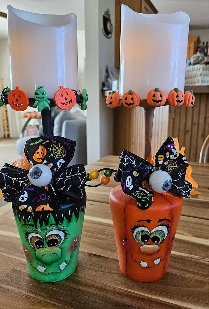 Hand painted Halloween candle holders on a dining table