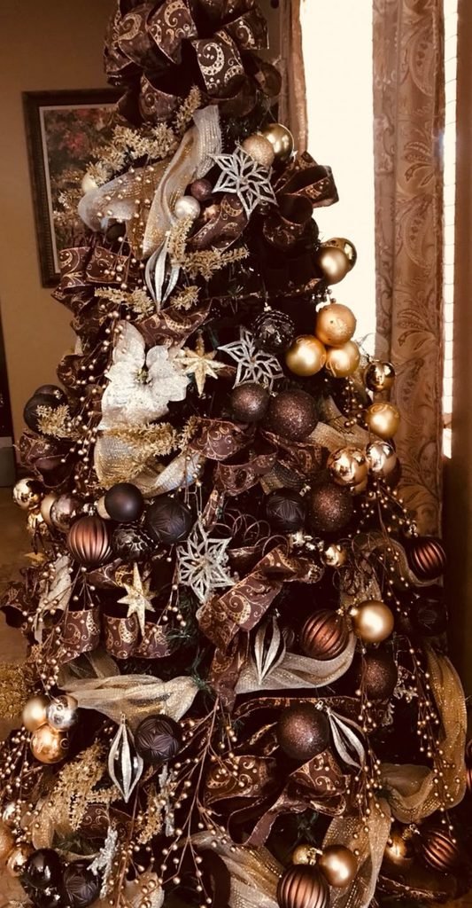 Chocolate brown and bronze Christmas tree with velvet ribbons and amber glass ornaments.
