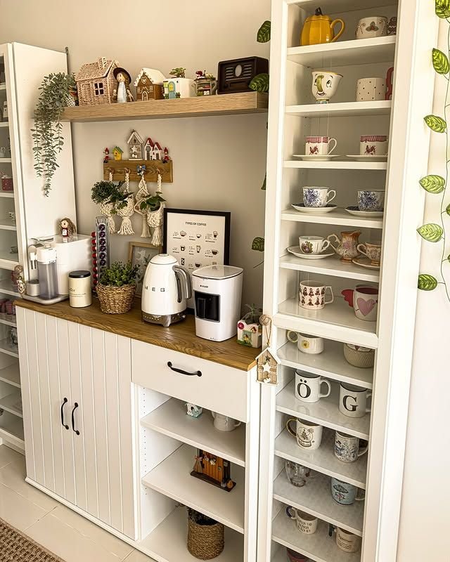 Coffee station with a wall-mounted mug rack, ceramic cups, espresso machine, and wooden shelf