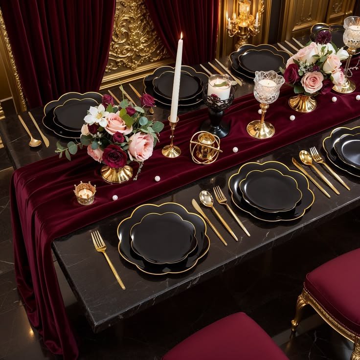 Elegant Thanksgiving table with burgundy napkins, brass accents, cream dinnerware, and seasonal foliage.