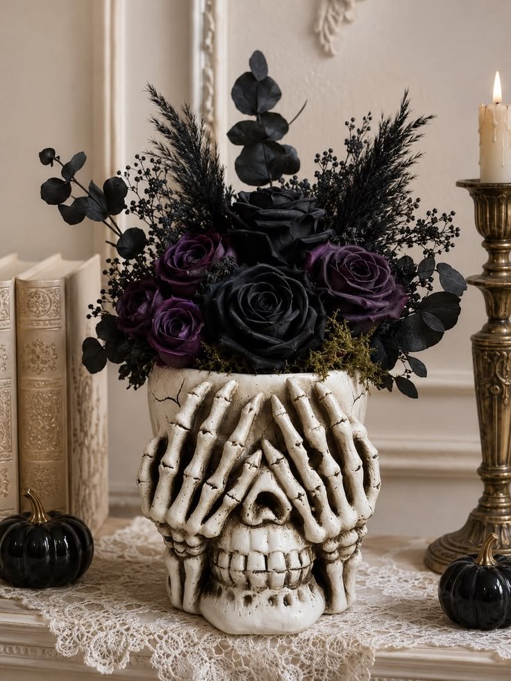 Gothic Halloween floral arrangement with burgundy flowers, dried branches, and a black ceramic vase.