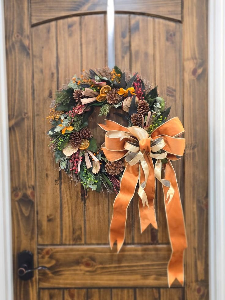 Handmade Thanksgiving decor ideas wreath with dried foliage and wheat on a front door