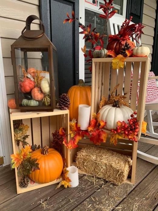 Rustic wooden crate filled with pumpkins and natural Thanksgiving decorations