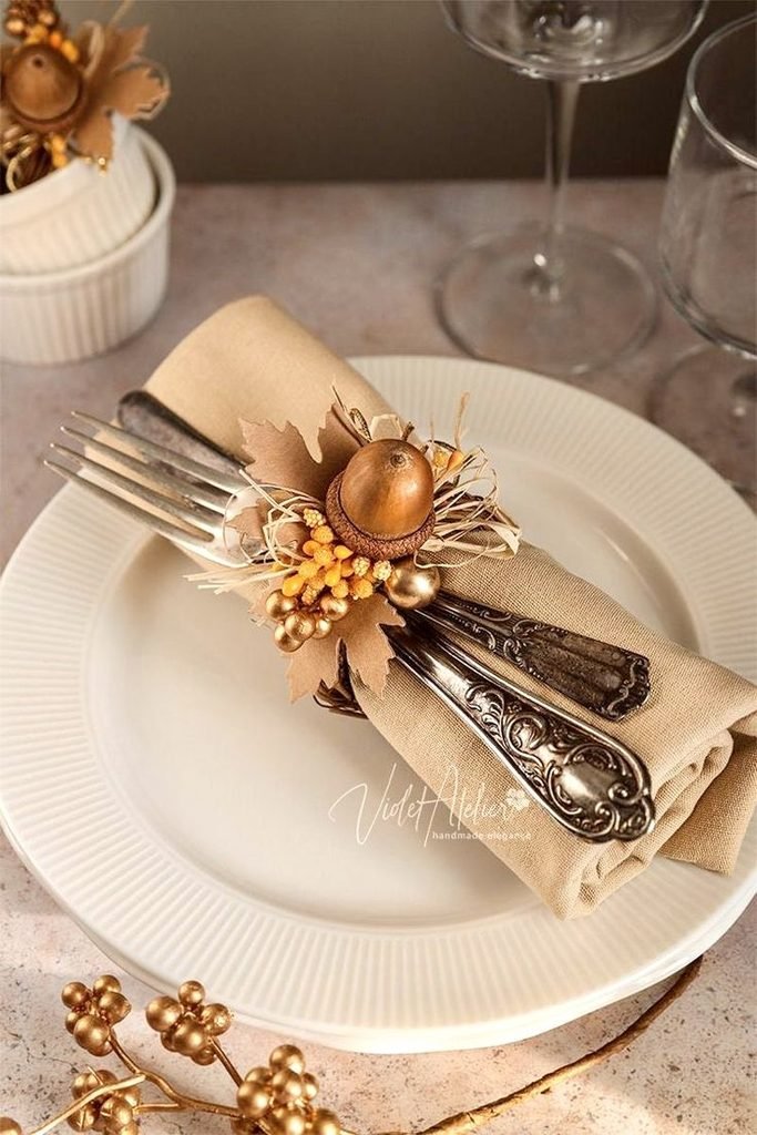 Linen Thanksgiving napkin tied with twine and a dried leaf